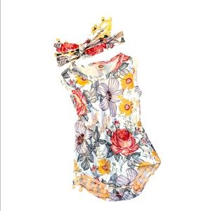 Gorgeous floral onesie with matching adjustable headband & Pom Pom details.